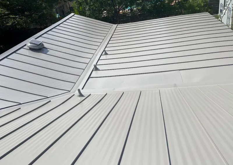 Solar attic fan installed on a metal roof for Roof Ventilation in Hanahan